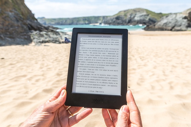 Reading Kindle on the beach