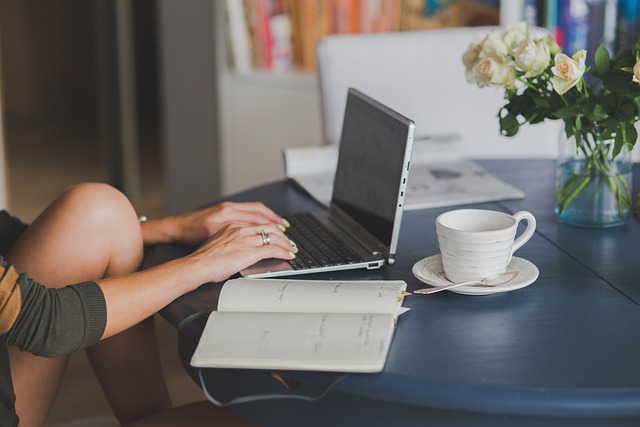 Typing on a laptop